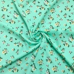Yellow and White Daisy Floral Print on Mint Green Bubble Crepe Fabric